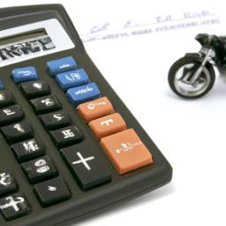 A calculator with keys showing the financial calculations involved in refinancing a motorcycle loan.